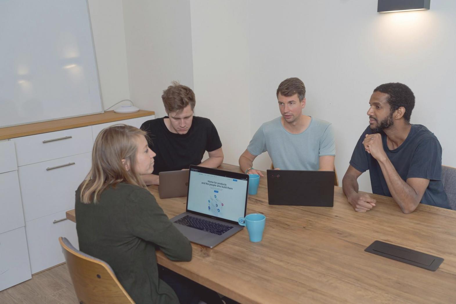 Family working together on financial planning at kitchen table